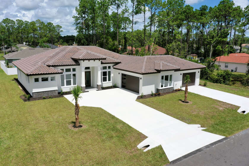 NEW CONSTRUCTION! Gorgeous and Modern home located in the golf - Beach Home for sale in Palm Coast, Florida on Beachhouse.com