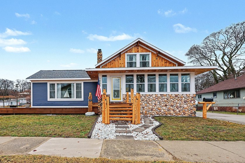 Welcome to an ultra-custom, one-of-a-kind home nestled in the - Beach Home for sale in Muskegon, Michigan on Beachhouse.com