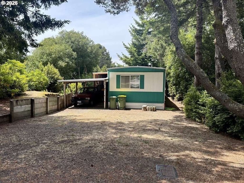 Located in the highly sought-after Greentrees Village, a gated - Beach Home for sale in Florence, Oregon on Beachhouse.com
