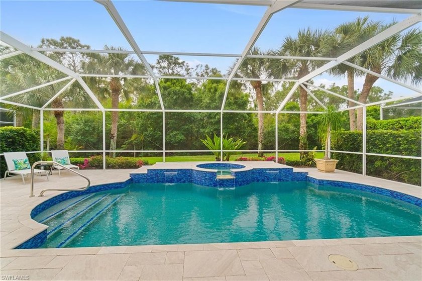 Sun-drenched southern exposure, a stunning updated pool, and - Beach Home for sale in Estero, Florida on Beachhouse.com