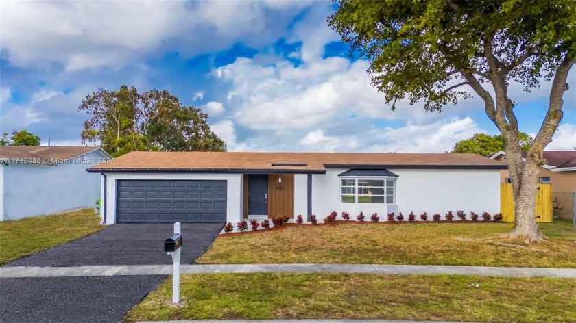 Wow !!! Beautiful and completely remodeled 4bed/2bath house with - Beach Home for sale in Sunrise, Florida on Beachhouse.com