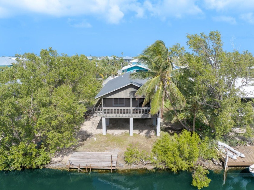 Idyllic Breezeswept Beach Estates waterfront home, boasting a - Beach Home for sale in Ramrod Key, Florida on Beachhouse.com