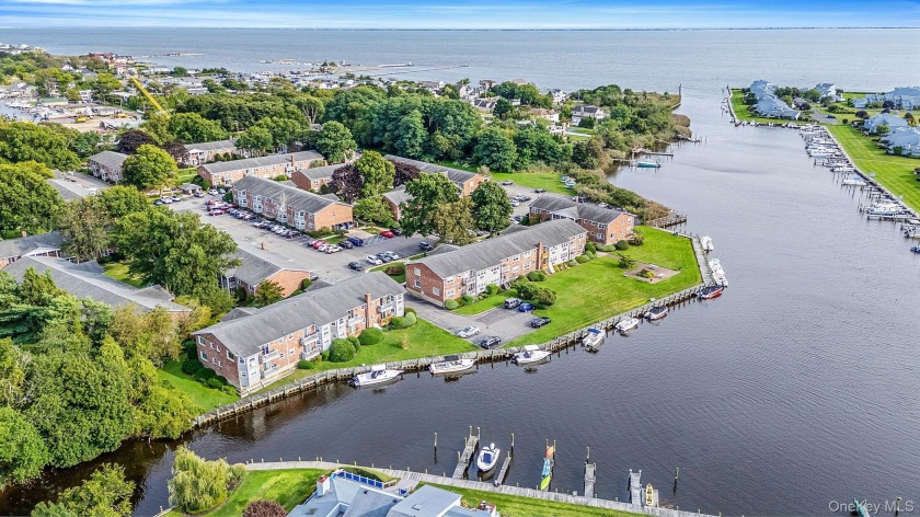 Pet-friendly waterfront co-op with direct water access! This 1 - Beach Home for sale in Patchogue, New York on Beachhouse.com
