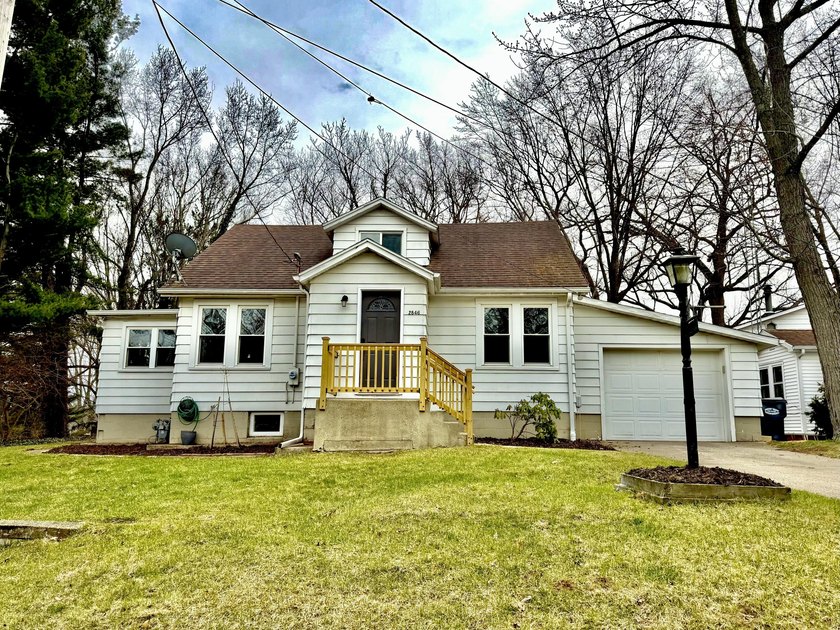 Don't miss this beautifully updated home located in the Village - Beach Home for sale in Stevensville, Michigan on Beachhouse.com