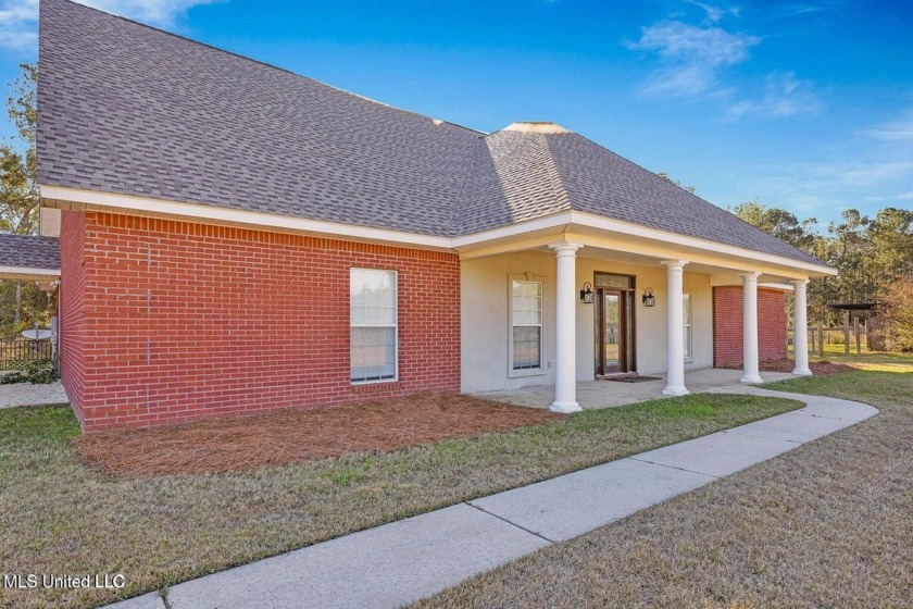 Tucked away on 5 serene acres at the end of a long gravel drive - Beach Home for sale in Long Beach, Mississippi on Beachhouse.com