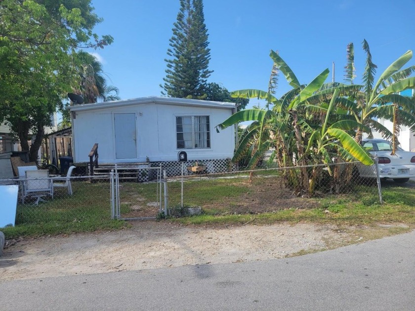 This 4 Bedroom 2-bathroom doublewide sits on a corner fenced lot - Beach Home for sale in Stock Island, Florida on Beachhouse.com