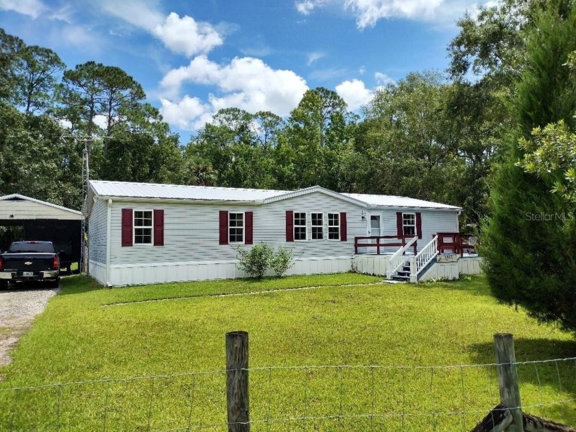 Discover this beautifully updated 3 bedroom, 2 bath manufactured - Beach Home for sale in Bunnell, Florida on Beachhouse.com
