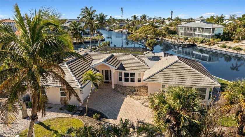 In a quaint and desirable boating community where the streets - Beach Home for sale in Sanibel, Florida on Beachhouse.com