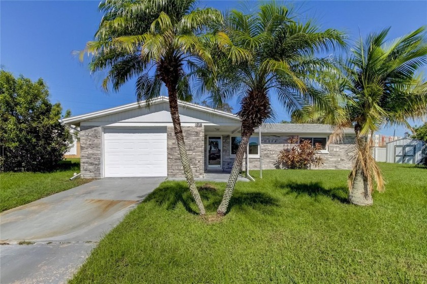 Welcome to this beautifully updated 2-bedroom, 1.5-bathroom home - Beach Home for sale in Holiday, Florida on Beachhouse.com