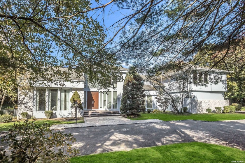 Welcome to this Magnificent Contemporary Center Hall Colonial in - Beach Home for sale in Laurel Hollow, New York on Beachhouse.com