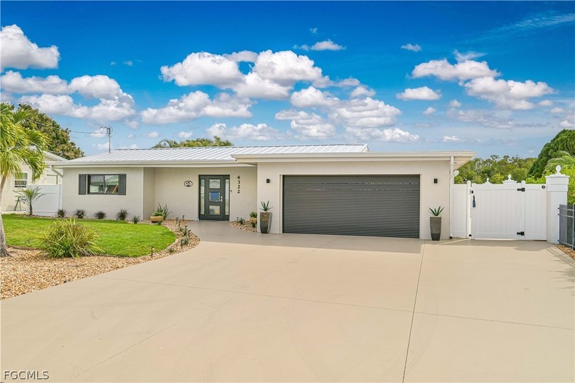 This 4-bedroom, 3-bath waterfront home is a true boater's - Beach Home for sale in North Fort Myers, Florida on Beachhouse.com