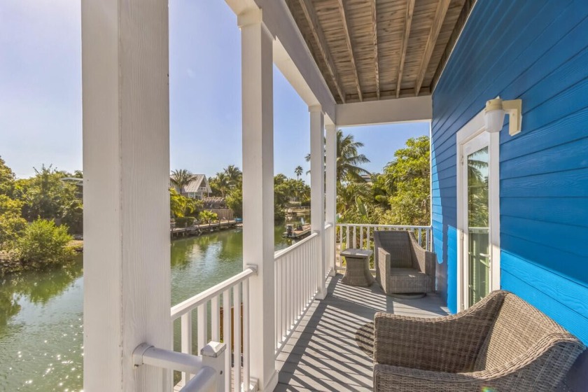 Enjoy waterfront views of the canal from this beautiful home - Beach Home for sale in Saddlebunch, Florida on Beachhouse.com