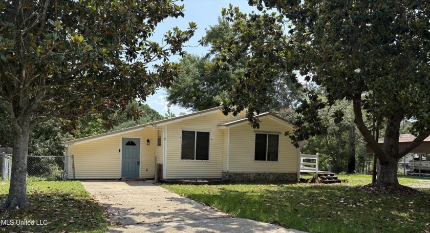 Nestled on two spacious lots boasting 0.76 acres and embraced by - Beach Home for sale in Gautier, Mississippi on Beachhouse.com
