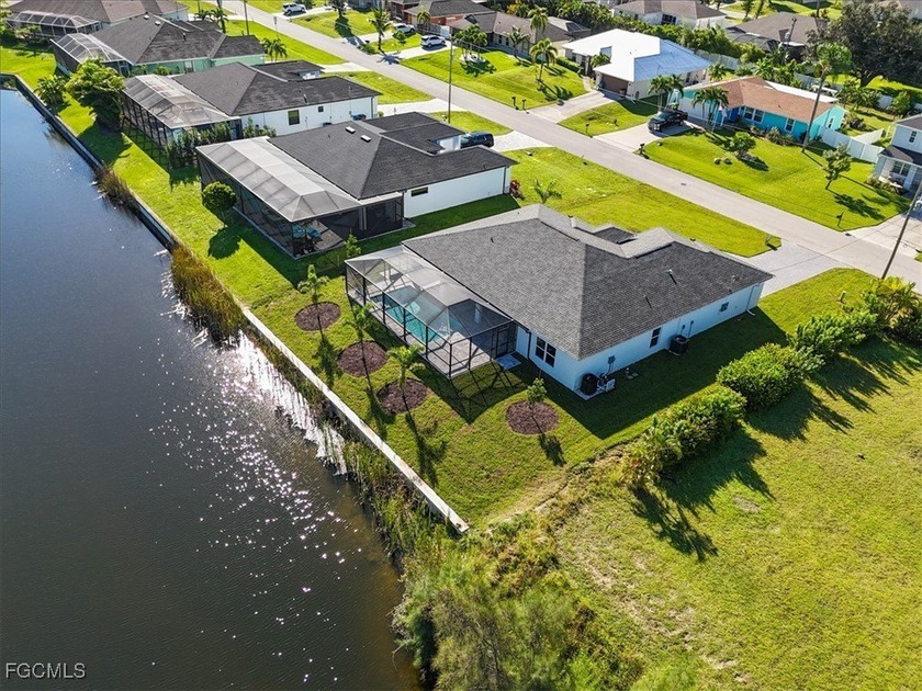 WATERFRONT PARADISE ON CITY WATER/SEWER WITH DUAL PRIMARY SUITES - Beach Home for sale in Cape Coral, Florida on Beachhouse.com