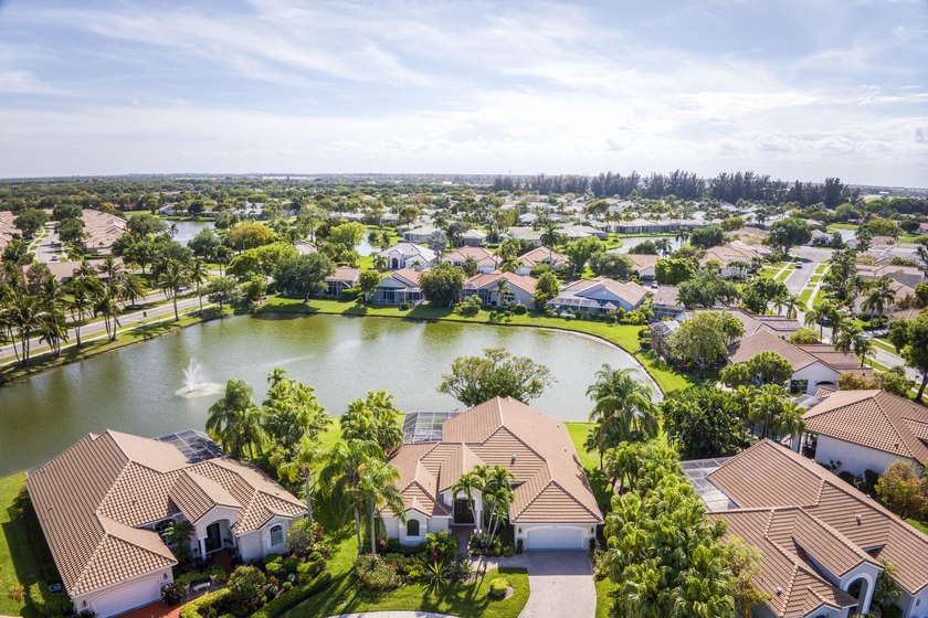 Serene lakefront living with a heated pool, spa, and tranquil - Beach Home for sale in Boynton Beach, Florida on Beachhouse.com