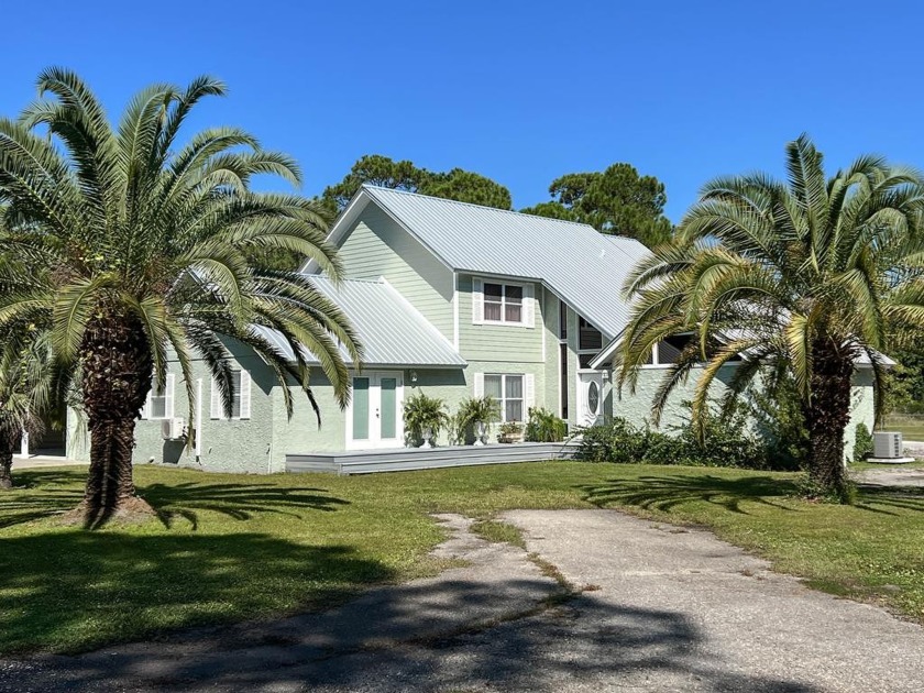 This lovely contemporary home is located on five acres of - Beach Home for sale in Apalachicola, Florida on Beachhouse.com