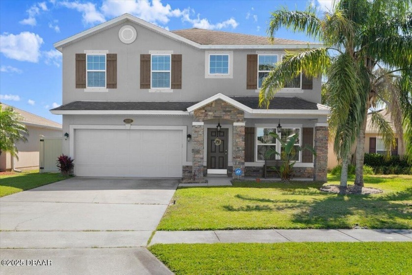 Welcome to this beautifully landscaped 2-story lakefront pool - Beach Home for sale in Port Orange, Florida on Beachhouse.com