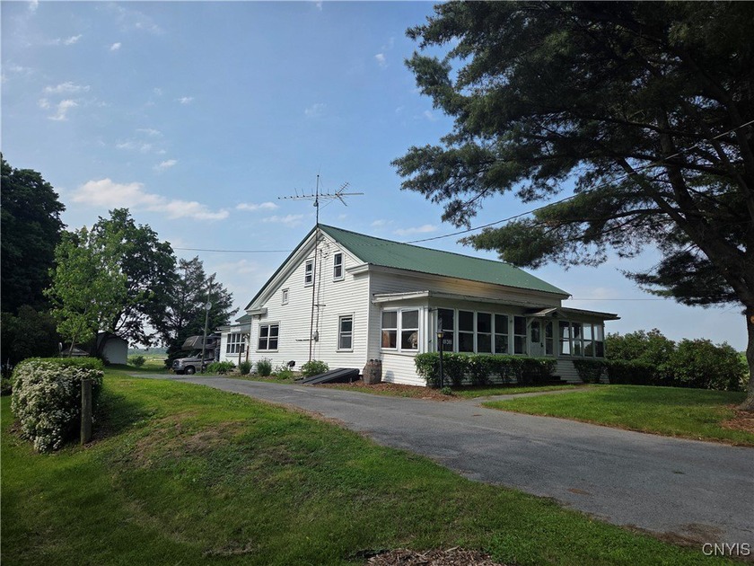 Rustic-Style Farmhouse with Acreage & Prime Outdoor Access - - Beach Home for sale in Mannsville, New York on Beachhouse.com