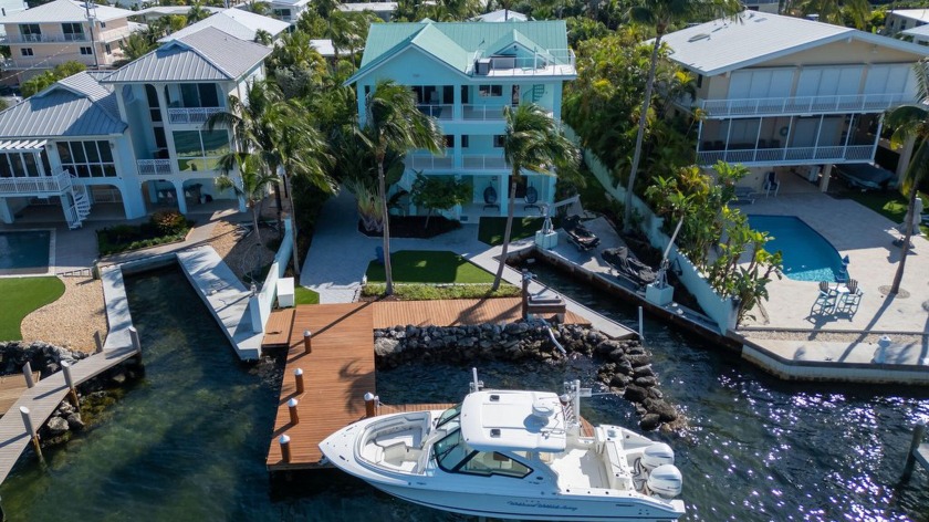 Discover coastal luxury in this stunning 4-bedroom, 4-bathroom - Beach Home for sale in Plantation Key, Florida on Beachhouse.com