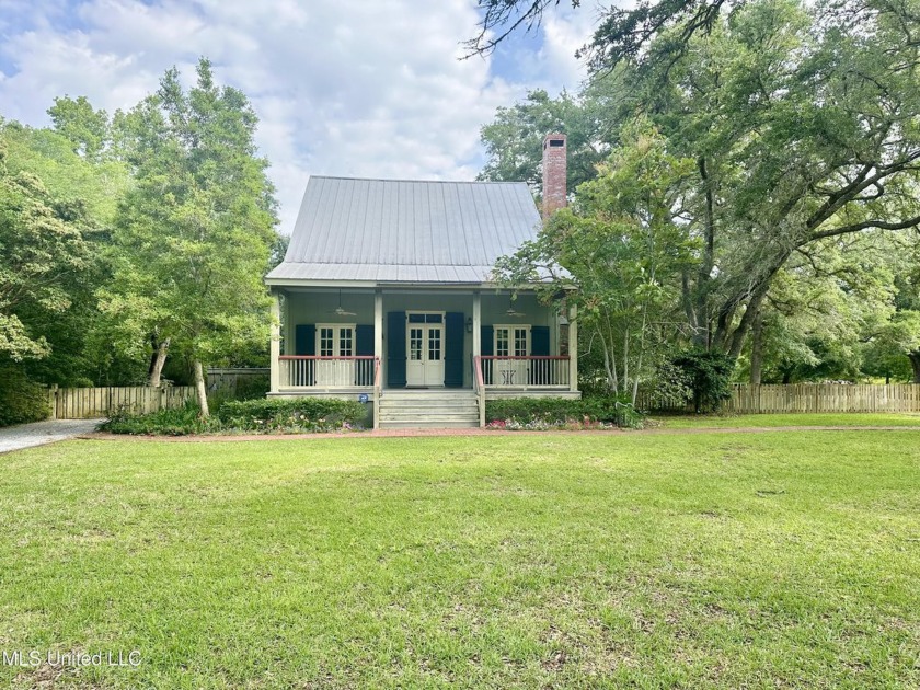 Nestled on 5.3 beautifully landscaped acres just one block from - Beach Home for sale in Pass Christian, Mississippi on Beachhouse.com