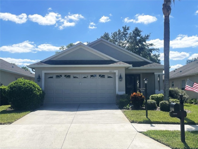 Welcome home to Heritage Pines, a vibrant 55+ guard-gated golf - Beach Home for sale in Hudson, Florida on Beachhouse.com