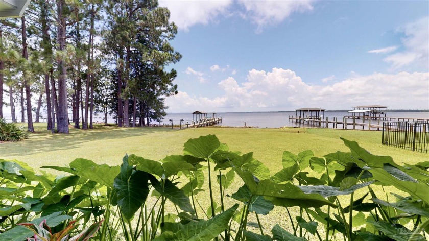 This waterfront home is a rare find. Almost a full acre of - Beach Home for sale in Navarre, Florida on Beachhouse.com