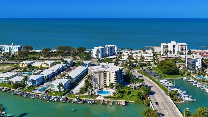 BAY & BEACH VIEWS & ACCESS! Experience coastal luxury just steps - Beach Condo for sale in Naples, Florida on Beachhouse.com