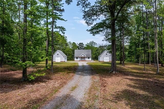 Creek cottage with two detached garages on over 8 acres in White - Beach Home for sale in White Stone, Virginia on Beachhouse.com