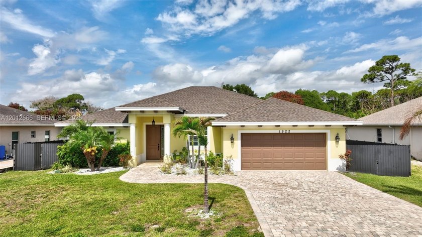 Step into elevated living just 15 minutes from the beach in this - Beach Home for sale in Port Saint Lucie, Florida on Beachhouse.com