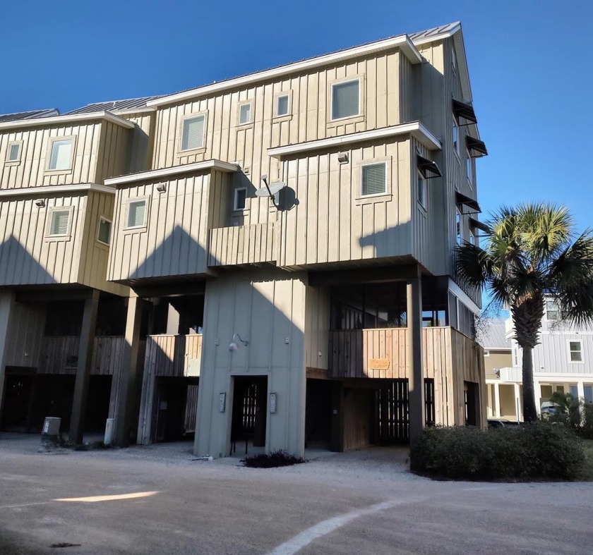 This end unit features a large screened-in porch on the first - Beach Condo for sale in Carabelle, Florida on Beachhouse.com