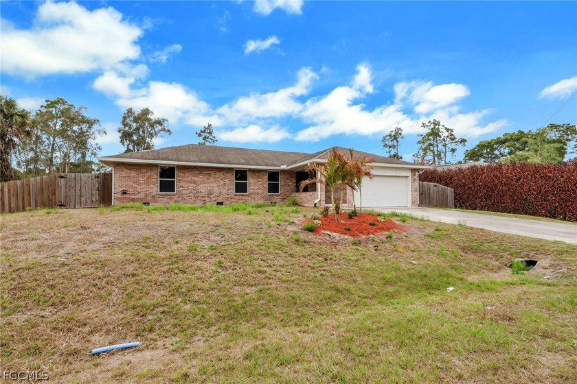 Discover the timeless appeal of this brick home nestled in a - Beach Home for sale in Lehigh Acres, Florida on Beachhouse.com