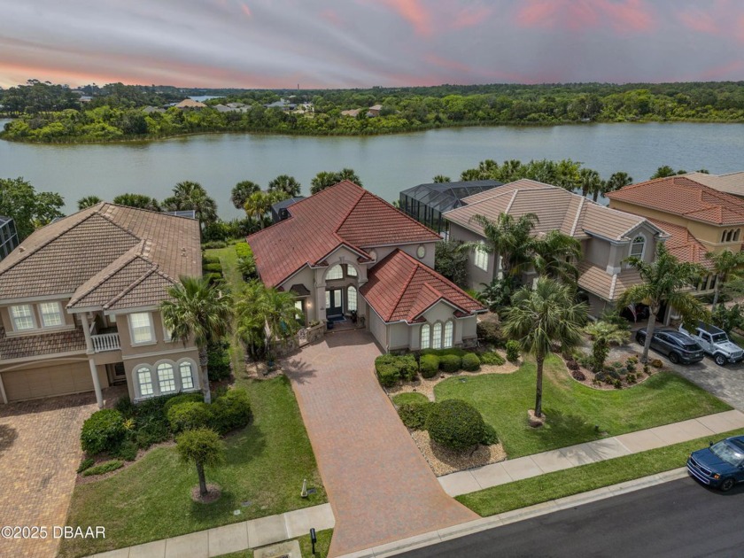 Welcome to this luxurious lakefront pool home nestled in the - Beach Home for sale in Palm Coast, Florida on Beachhouse.com