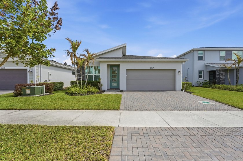 Built in 2022, this 4-bedroom, 3-bath single-story home in a - Beach Home for sale in Port Saint Lucie, Florida on Beachhouse.com