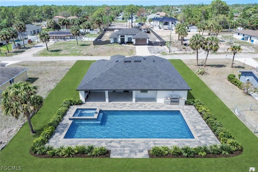***NEW CONSTRUCTION - HALF-ACRE LOT - MODERN DESIGN*** Not your - Beach Home for sale in Lehigh Acres, Florida on Beachhouse.com
