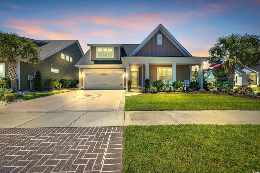 Relax on the welcoming front porch and soak up the sunshine in - Beach Home for sale in North Myrtle Beach, South Carolina on Beachhouse.com