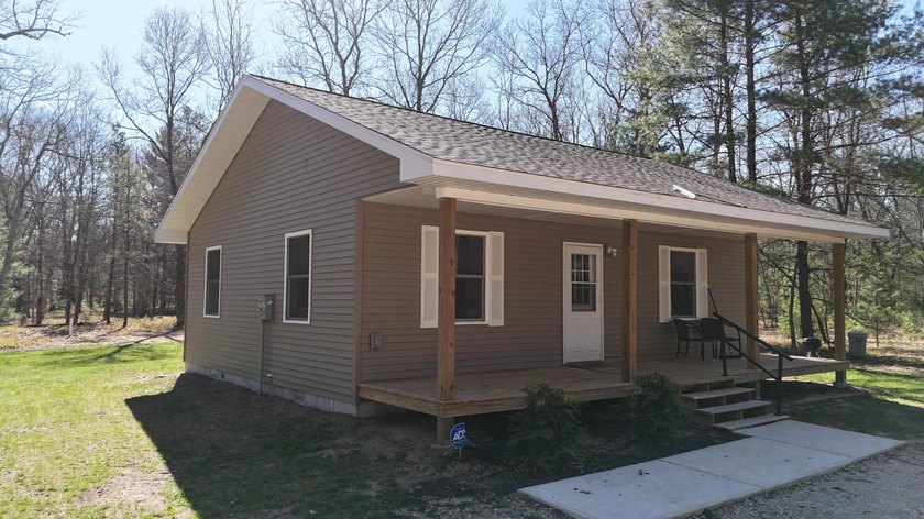 Where peace and quiet meets a bustling business, step onto this - Beach Home for sale in Manistee, Michigan on Beachhouse.com