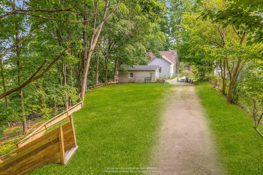 Welcome to this charming home located within walking distance of - Beach Home for sale in Montague, Michigan on Beachhouse.com