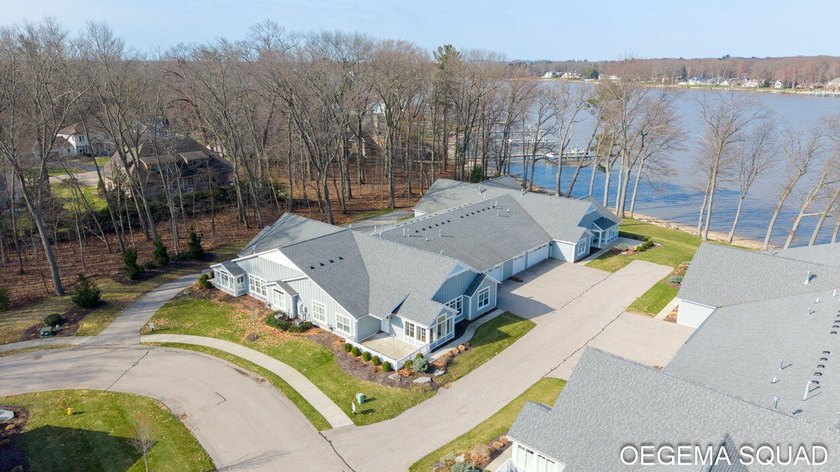 Experience exceptional waterfront living at The Villas of Lake - Beach Condo for sale in Holland, Michigan on Beachhouse.com