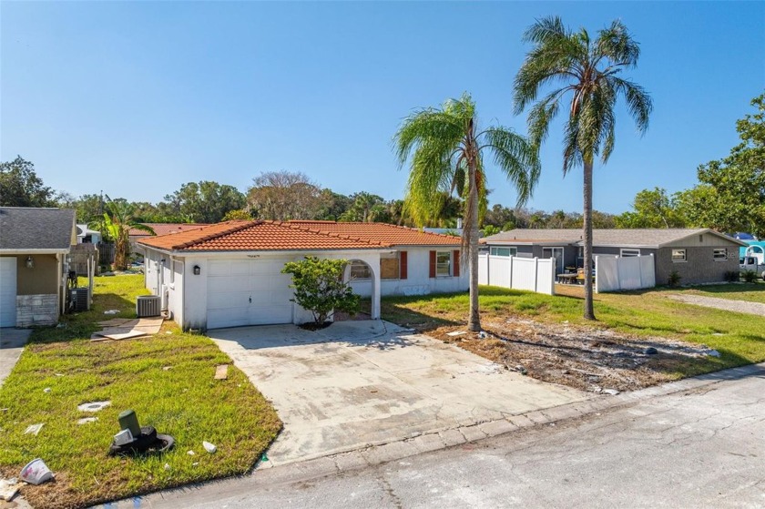 Investor Special! Cash only, this home was recently flooded from - Beach Home for sale in New Port Richey, Florida on Beachhouse.com