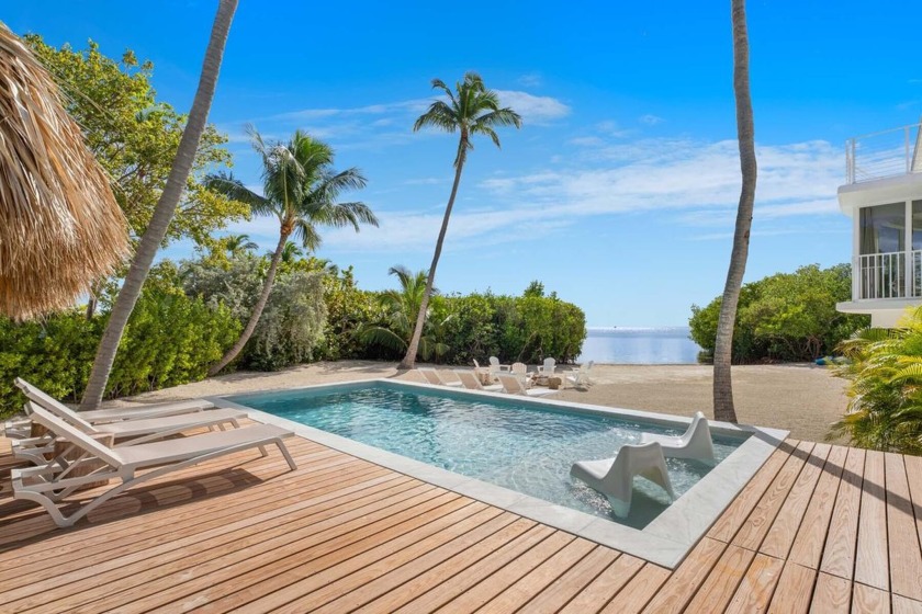 This breathtaking three-story beachfront home boasts six - Beach Home for sale in Upper Matecumbe Key, Florida on Beachhouse.com