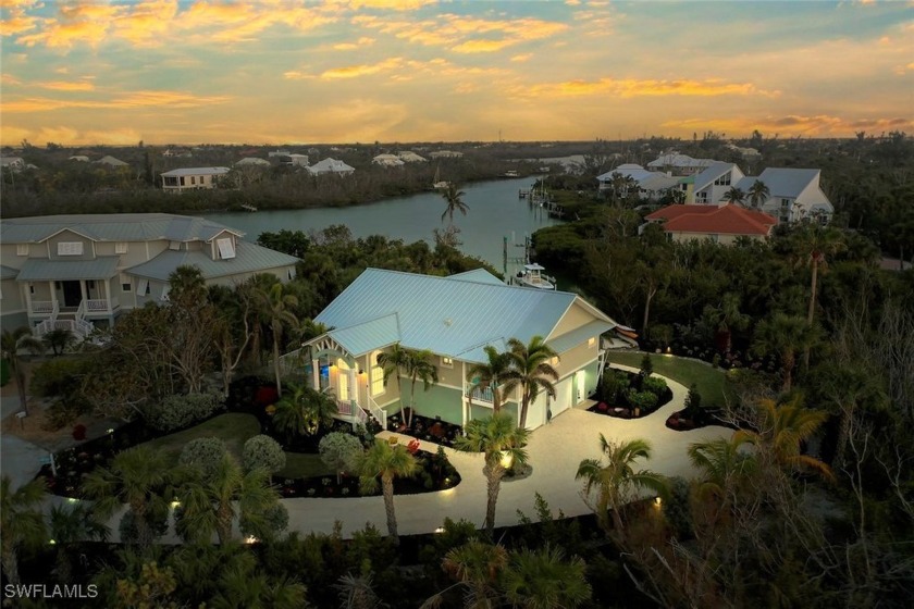 Nestled along the serene shores of Dinkins Bayou, this stunning - Beach Home for sale in Sanibel, Florida on Beachhouse.com