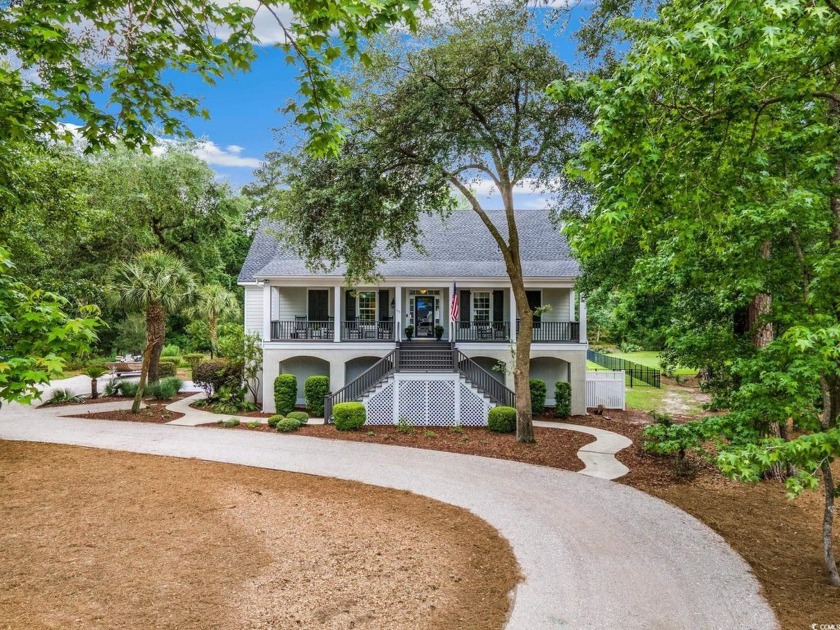 Nestled on a serene 1.88 acre wooded lot, enjoy resort-style - Beach Home for sale in Georgetown, South Carolina on Beachhouse.com