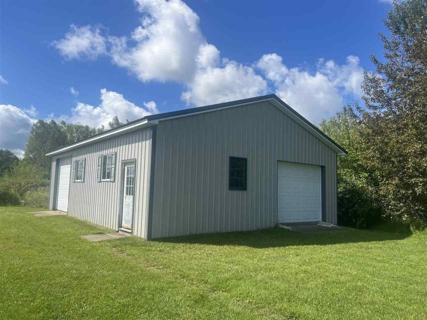 This beautiful property features a 30x40 pole barn equipped with - Beach Acreage for sale in Charlevoix, Michigan on Beachhouse.com