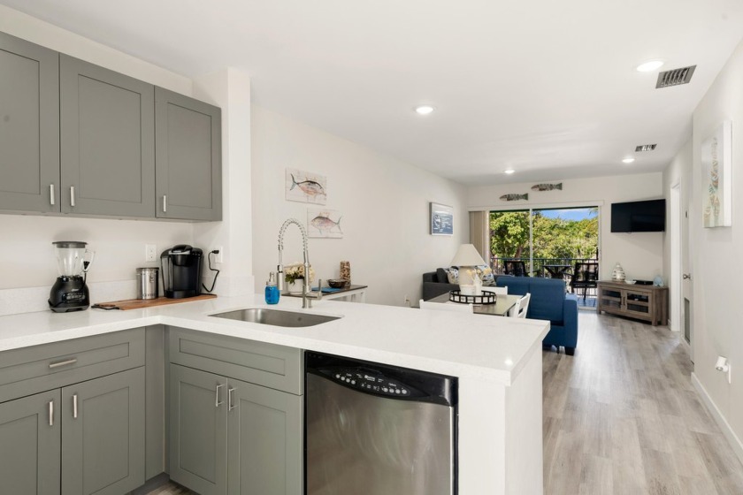 Indulge in the serene elegance of this fully renovated 2-bedroom - Beach Condo for sale in Key Largo, Florida on Beachhouse.com