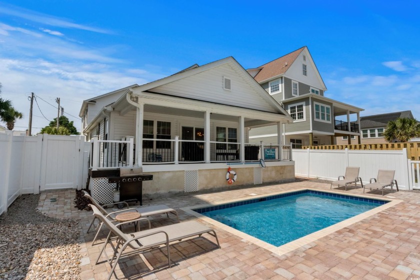 Discover the ultimate tropical getaway in this spacious - Beach Home for sale in North Myrtle Beach, South Carolina on Beachhouse.com