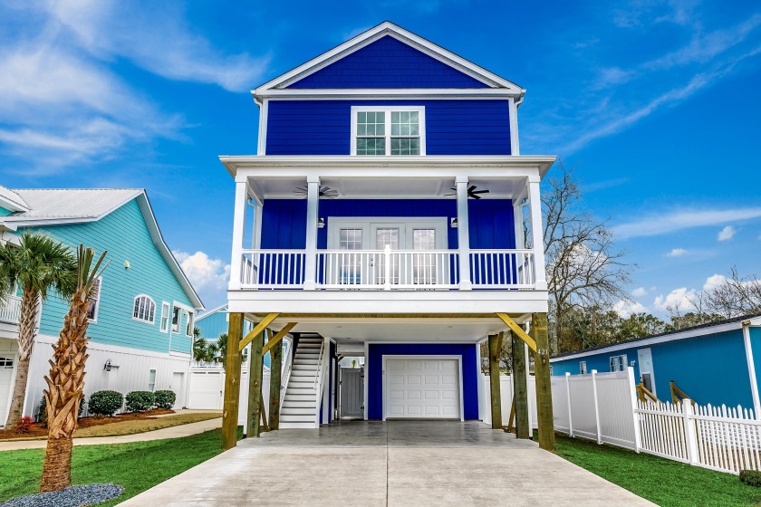 Only blocks from the beach, this home includes a front and rear - Beach Home for sale in Murrells Inlet, South Carolina on Beachhouse.com