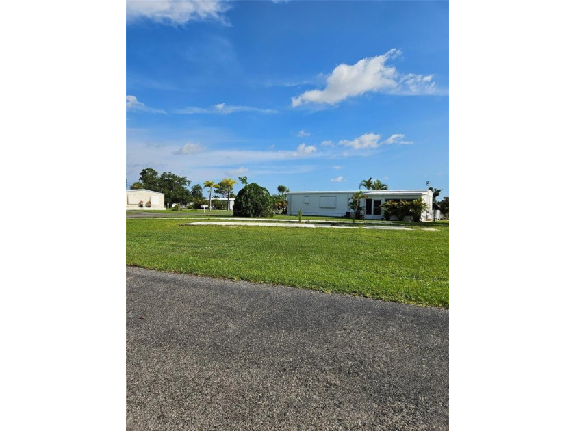 Welcome to the Village of Holiday Lake, an active WATERFRONT - Beach Lot for sale in Port Charlotte, Florida on Beachhouse.com