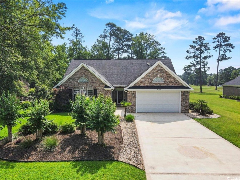 This stunning all-brick home in the sought-after Long Bay Golf - Beach Home for sale in Longs, South Carolina on Beachhouse.com