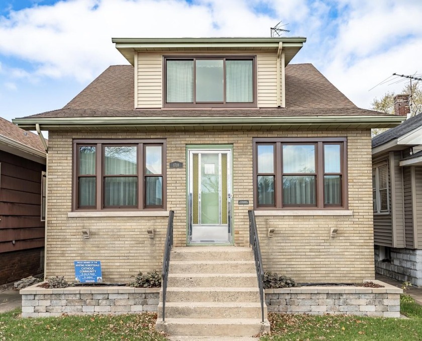 This charming brick bungalow is conveniently situated in the - Beach Home for sale in Whiting, Indiana on Beachhouse.com