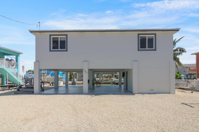 This modern concrete single-family home, built in 2022, features - Beach Home for sale in Big Pine Key, Florida on Beachhouse.com